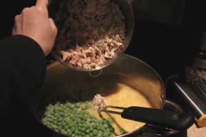 Adding in peas and meat