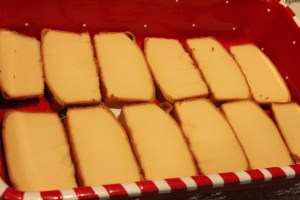 Line your pan with one layer of sliced pound cake. 