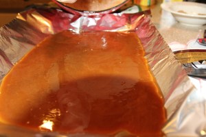 Pour out onto buttered foil on pan.