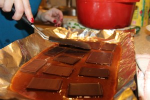 Add on chocolate bar pieces immediately. 